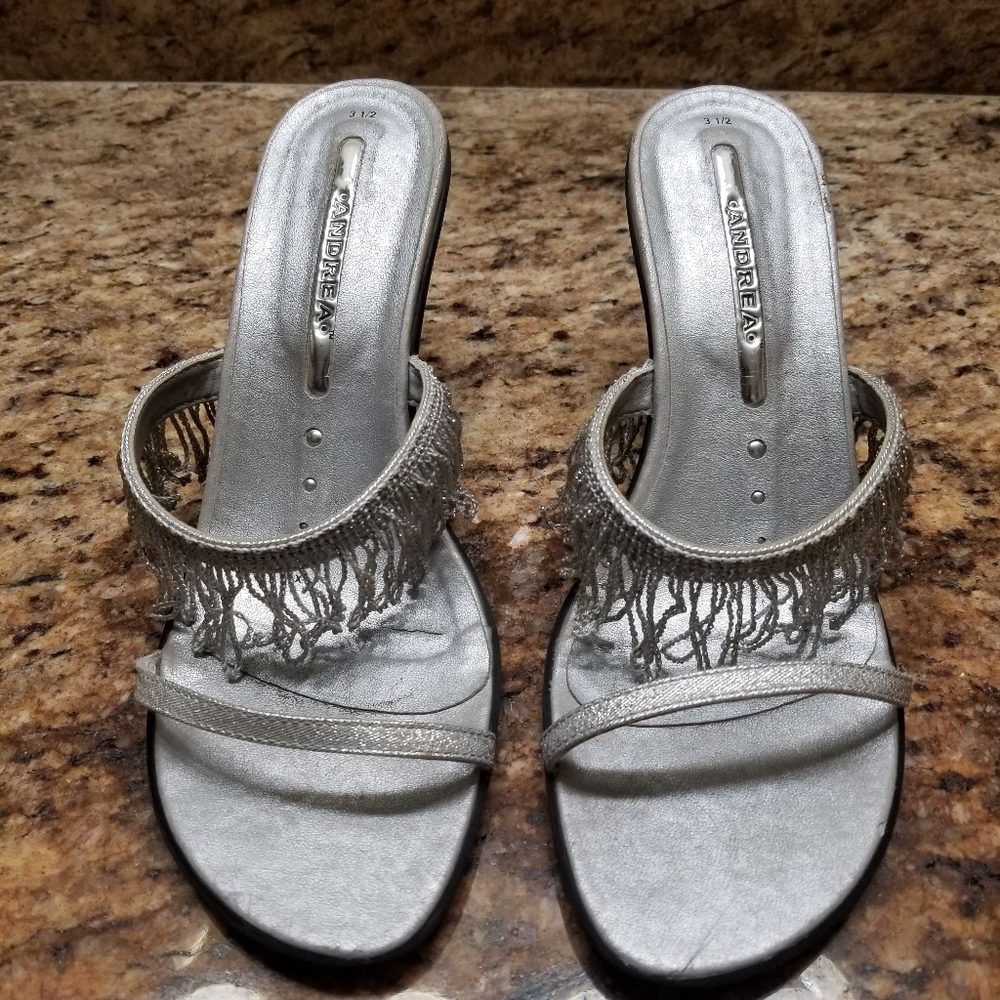 Lightly worn silver slip on shoes
